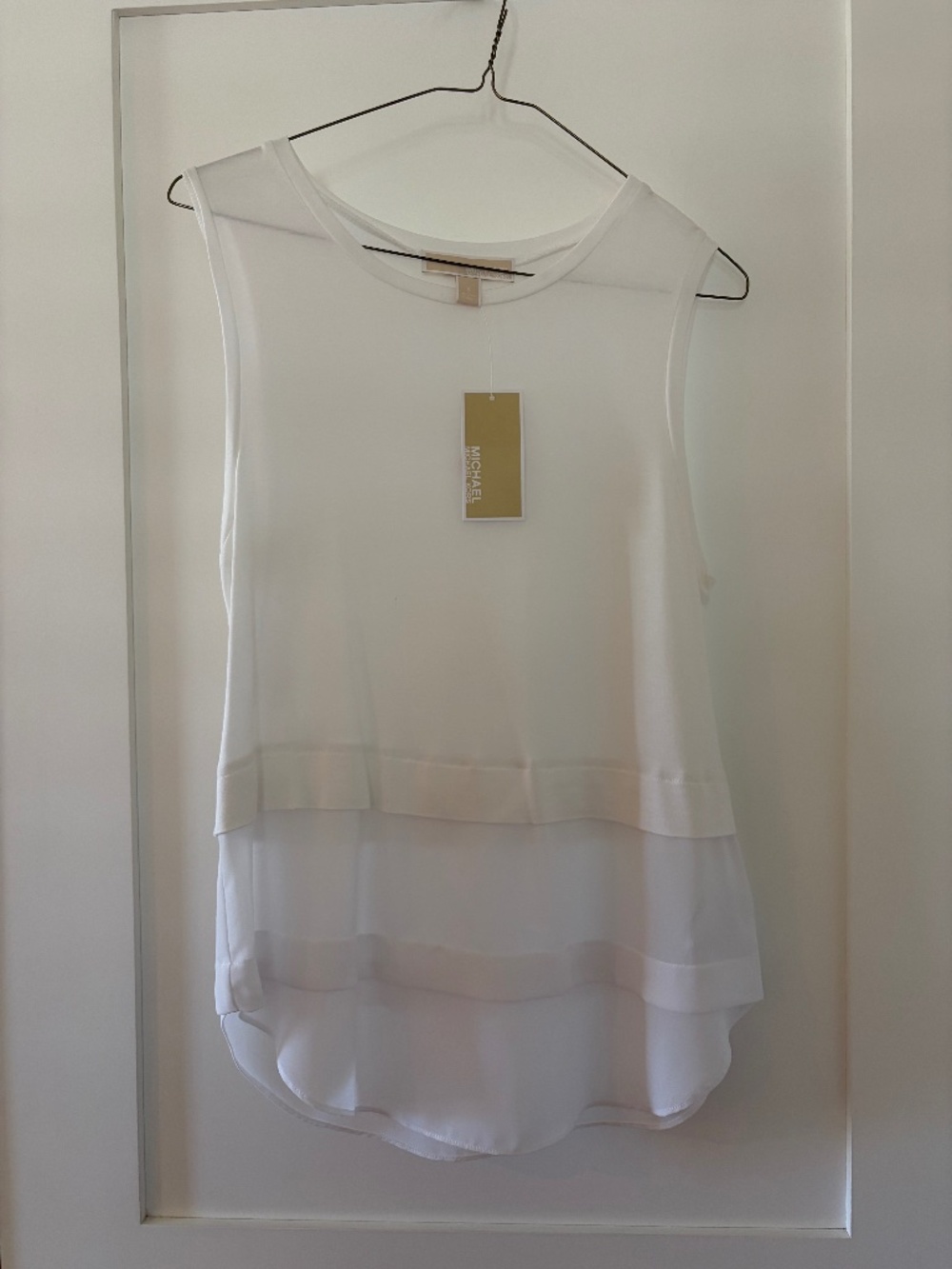 White sleeveless top